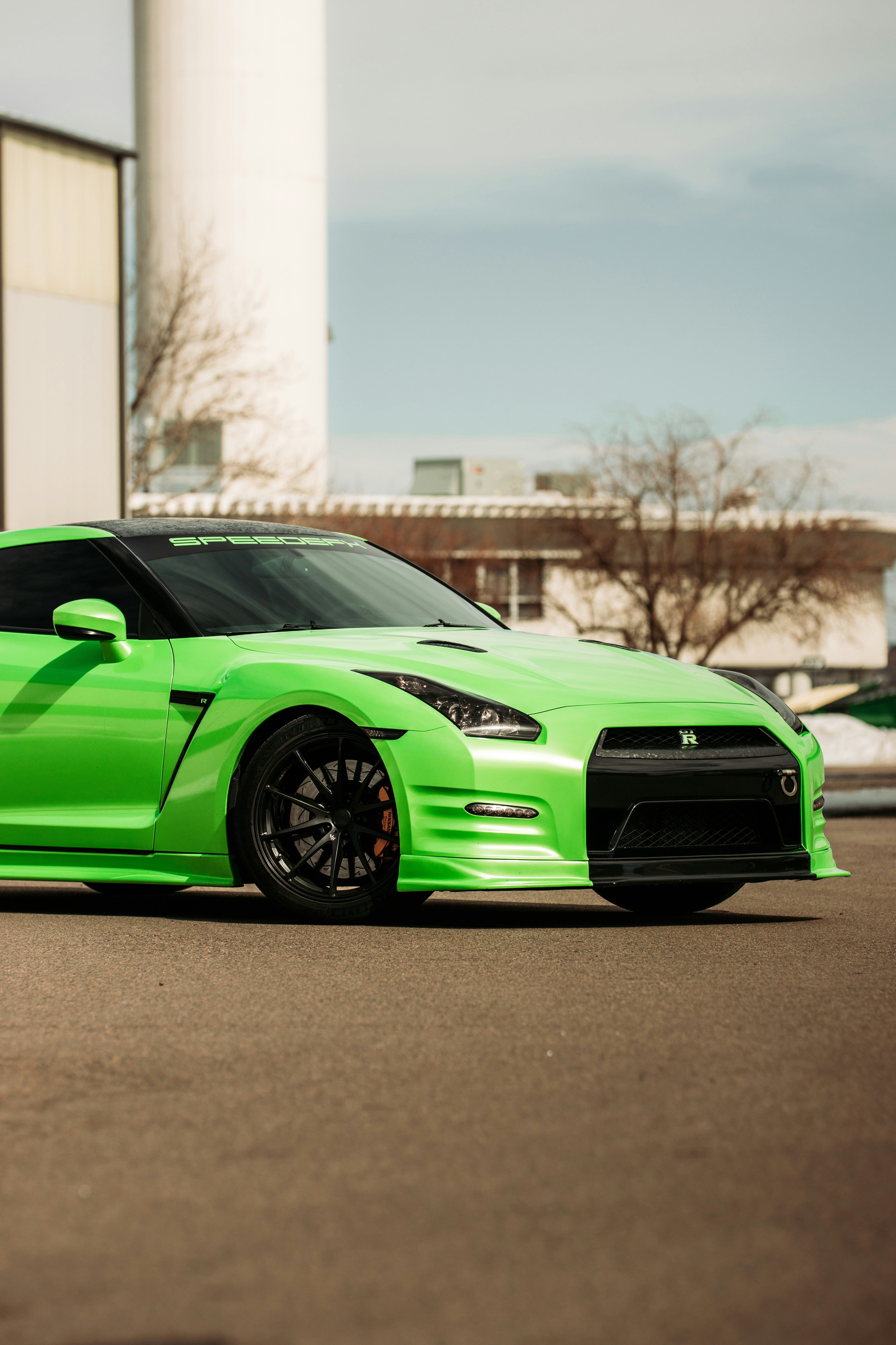 green and black chevrolet camaro